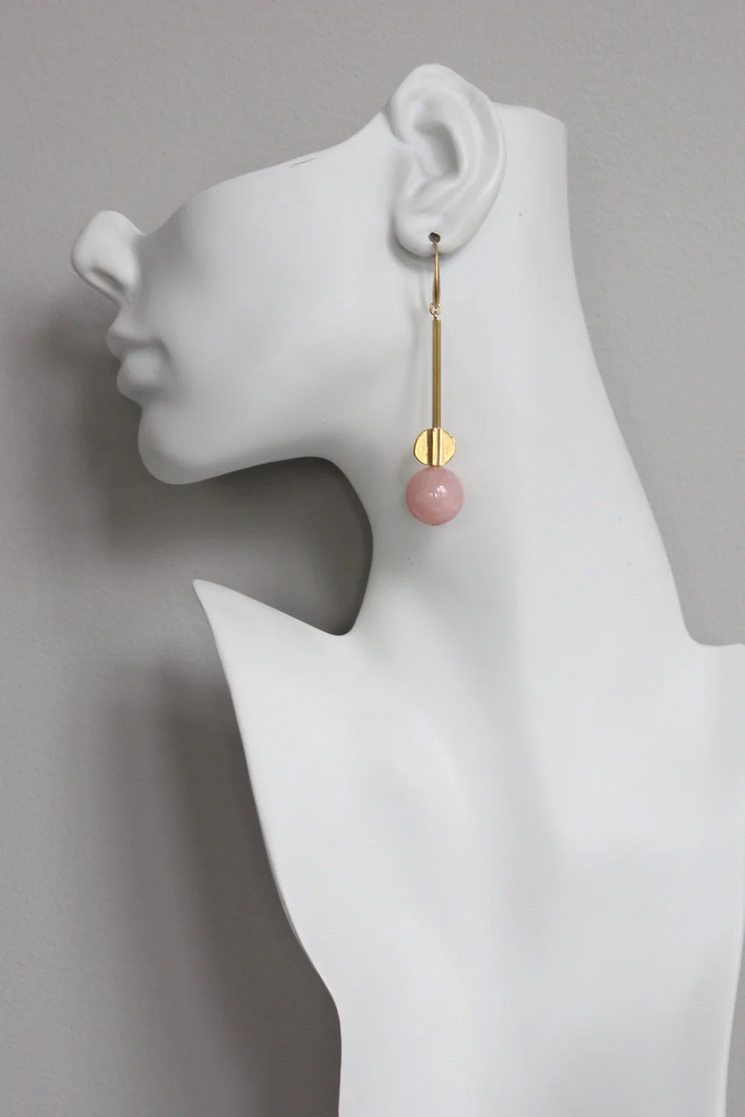 Model wearing David Aubrey brass and pink bead dangle earrings