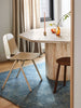 A modern dining room featurng the Tribe Home nz blue Nelson floor rug