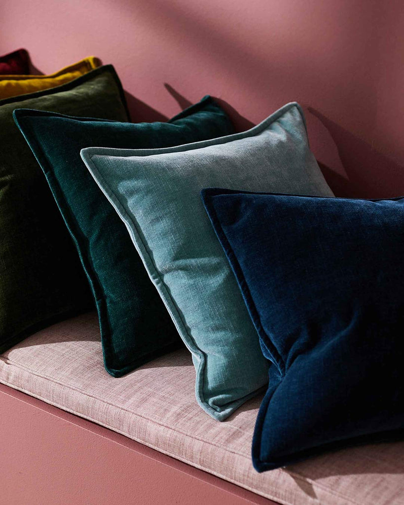 A striking line up of vintage velvet cushions, in exquisite on-trend blues and greens, by Weave Home NZ