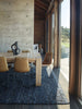 The Tribe Home NZ wool Skye blue floor rug seen in a stylish dining room under a table