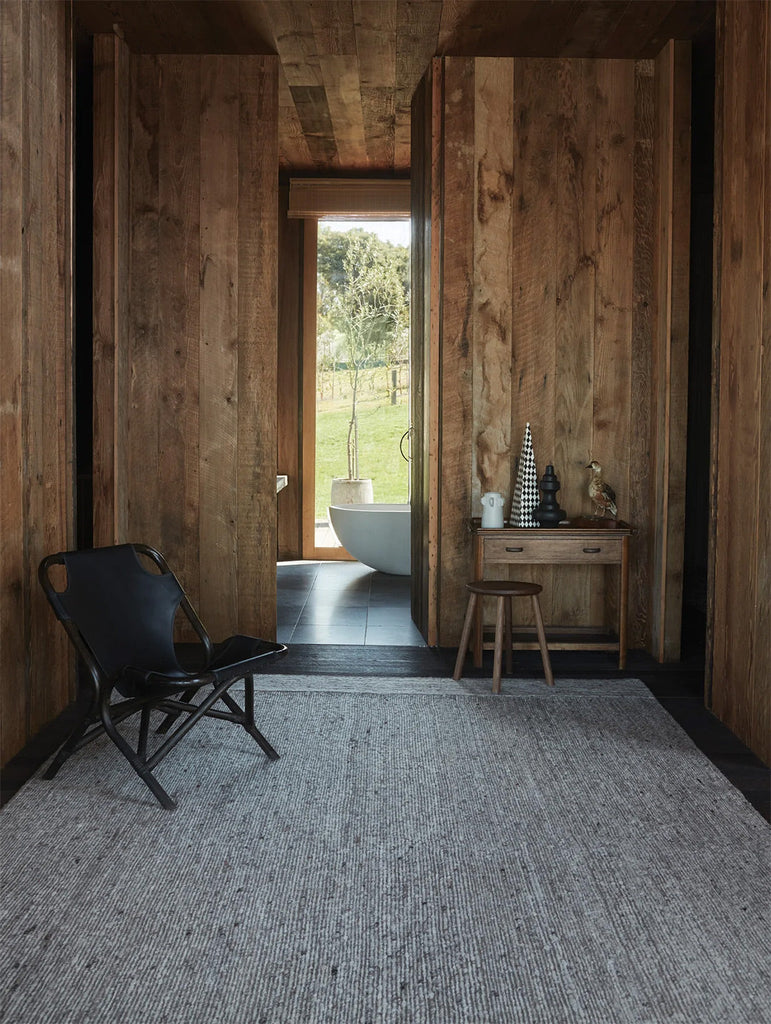 A modern timber room featuring the Tribe Home nz Oban wool floor rug