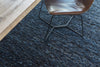 Close up of the Tribe Home nz Skye blue wool floor rug under a chair