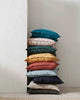 A beautiful stack of jewel-toned linen cushions by Weave Home NZ