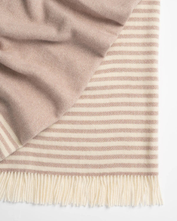 Close up of the Weave Home nz Catlins striped wool throw in rose pink and cream