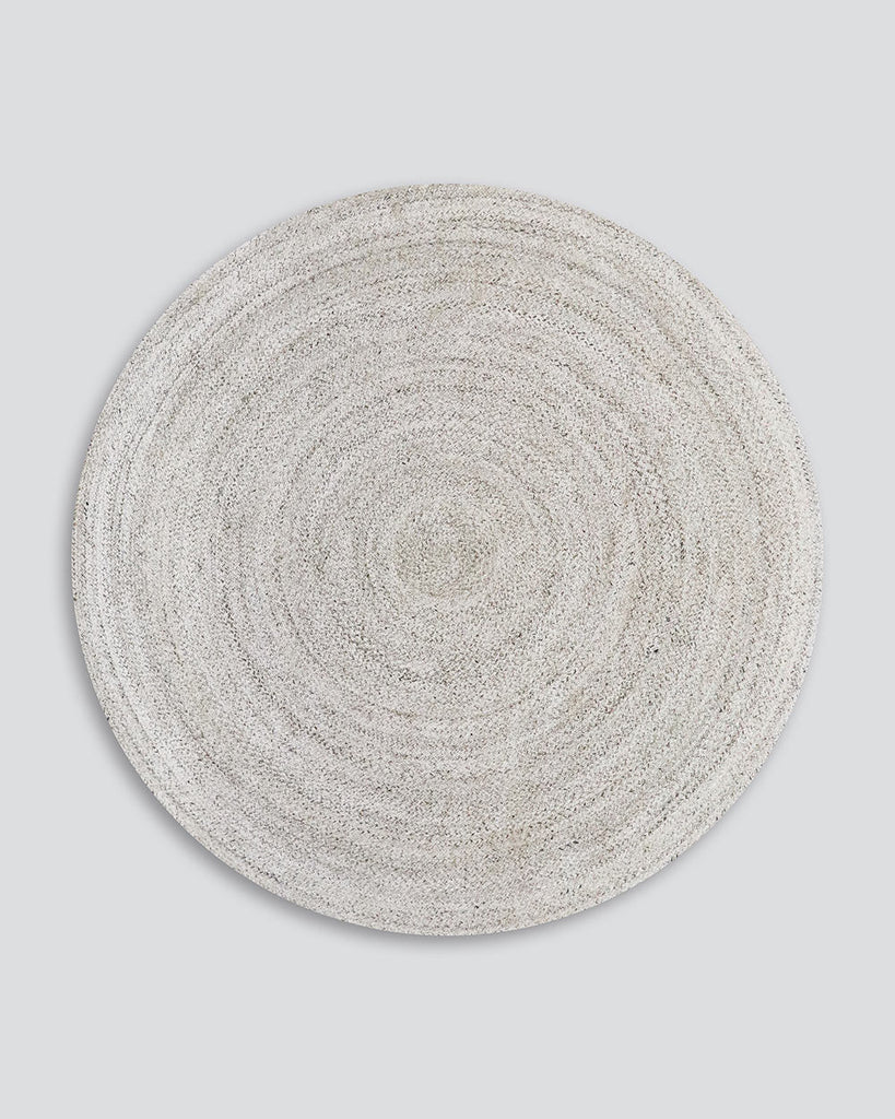 Full view of Baya NZ's Mornington in Pale Sand, a round outdoor rug in light, neutral tones. 